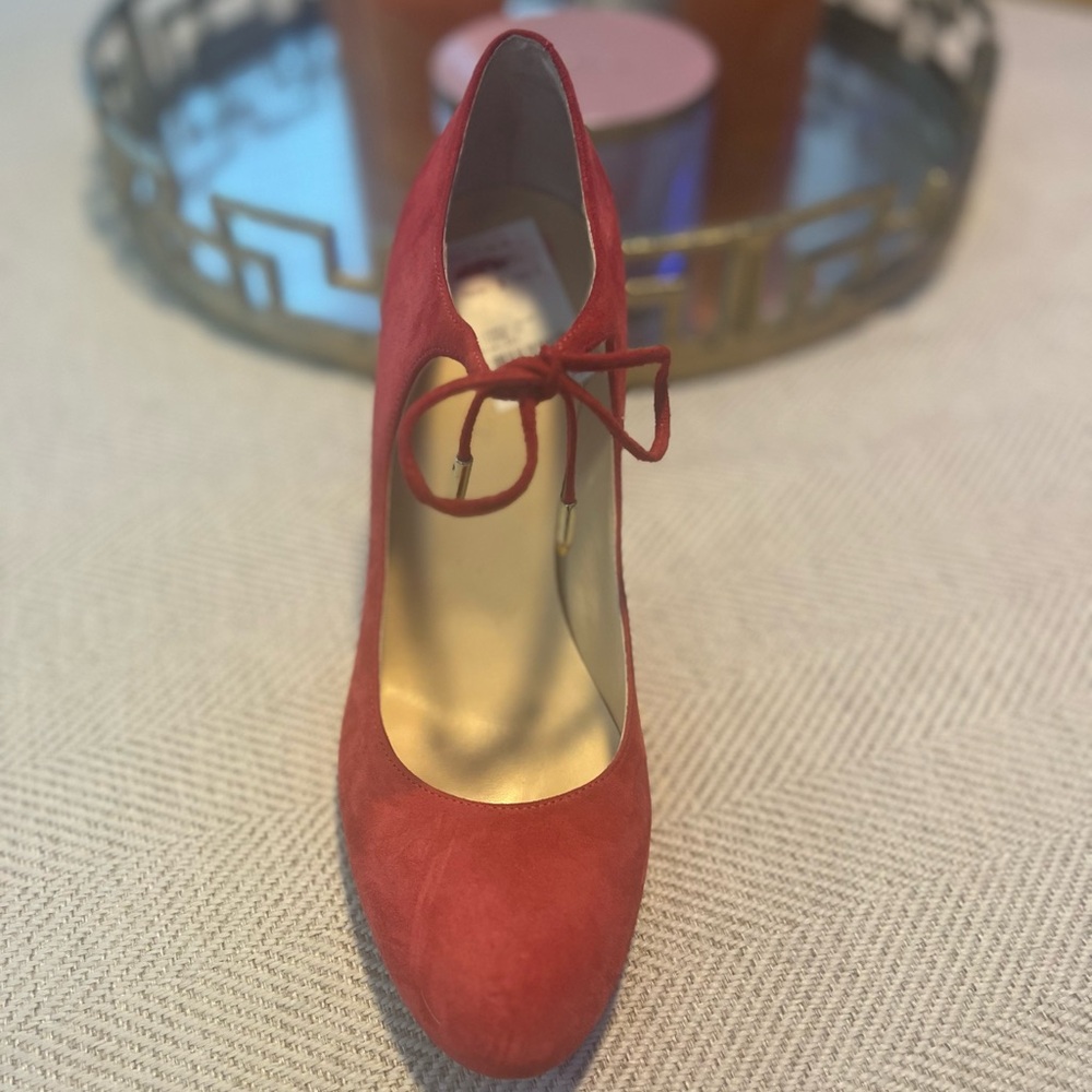 Ivanka Suede 4inch heel. Color would be described as deep pink grapefruit.